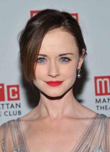 alexis bladel wearing black pearl earrings